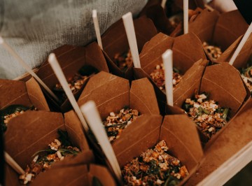 Noodle box with Thai beef salad with tomato, cucumber and chilli topped with coriander and peanuts <br />
