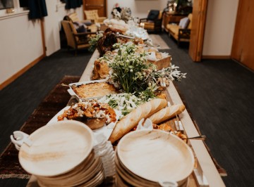 Sideboard:<br />
Whole lamb slow cooked served with Catering Dept. homemade mint jelly and jus<br />
Hot ham on the bone, bourbon brown sugar glaze with sour cherry chutney<br />
Creamy Agria gratin <br />
Whole roasted garlic bulbs <br />
Roasted kumara, squash and carrots with pomegranate vinaigrette, crumbled feta and seed clusters <br />
Platters of heirloom tomatoes piled with fresh basil and balsamic syrup <br />
Fresh cos, herb and parmesan salad <br />
Baguette, baps, quinoa molasses bread, Gluten free bread and butter<br />
