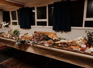 Sideboard:<br />
Whole lamb slow cooked served with Catering Dept. homemade mint jelly and jus<br />
Hot ham on the bone, bourbon brown sugar glaze with sour cherry chutney<br />
Creamy Agria gratin <br />
Whole roasted garlic bulbs <br />
Roasted kumara, squash and carrots with pomegranate vinaigrette, crumbled feta and seed clusters <br />
Platters of heirloom tomatoes piled with fresh basil and balsamic syrup <br />
Fresh cos, herb and parmesan salad <br />
Baguette, baps, quinoa molasses bread, Gluten free bread and butter