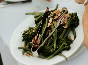 Platters of green beans, broccolini and toasted almonds.